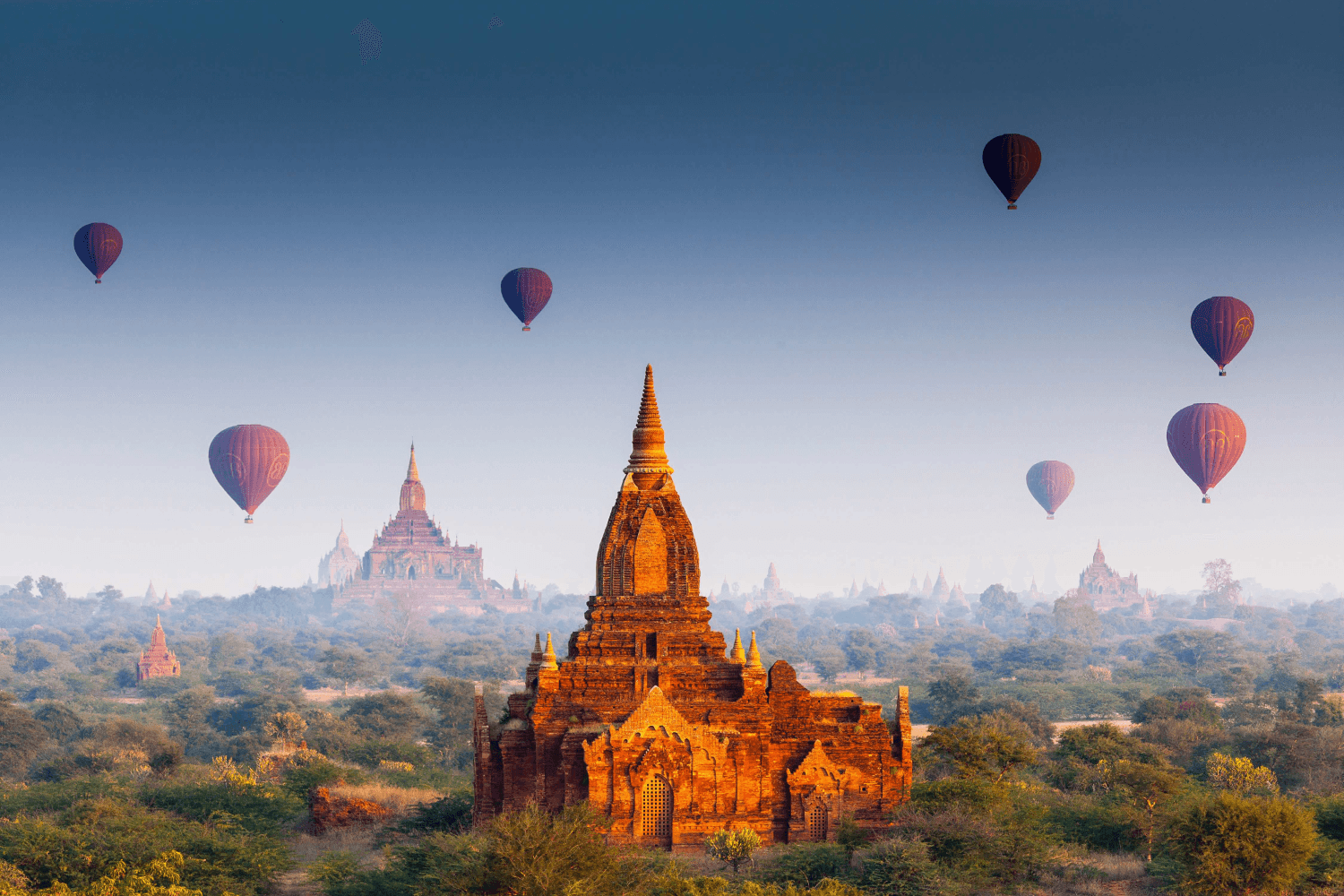 Bagan at sunrise with hot air balloons
